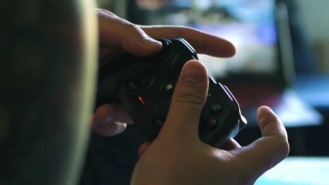 Game pad black playing game hold hands close up Stock Footage 108628100