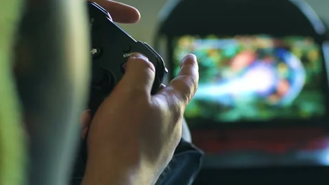 Game pad black playing game hold hands close up Stock Footage 108628408