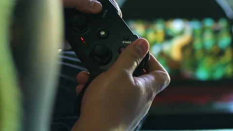 Game pad black playing game hold hands close up Stock Footage 108628630