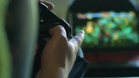 Game pad black playing game hold hands close up Stock Footage 108628976