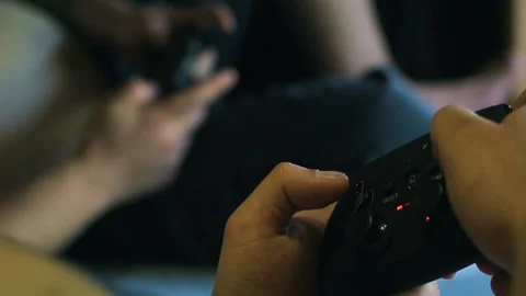 Game pad black playing game hold hands close up Stock Footage 108629168