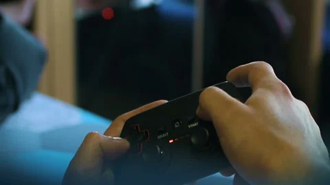 Game pad black playing game hold hands close up Stock Footage 108629384