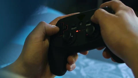 Game pad black playing game hold hands close up Stock Footage 108629546