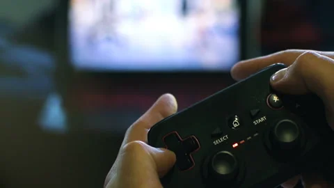 Game pad black playing game hold hands close up Stock Footage 108630274