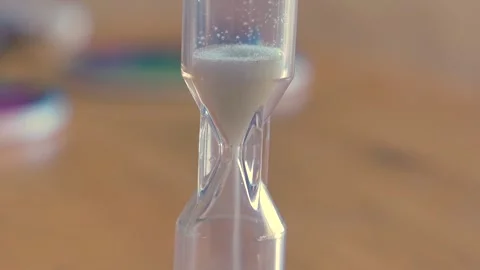 Game sand timer on a table Video stock 338176125