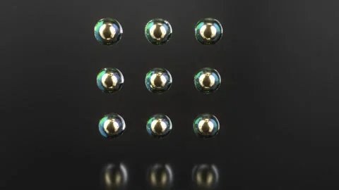 Game spheres metaballs loading glass gold balls able to loop endless Stock Footage 313344241