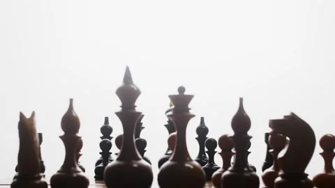 The game starts. Slender rows of chess pieces on a chessboard. The camera moves Stock Footage 233031504