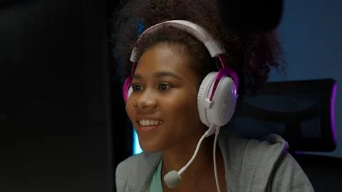 Game streamer using pc setup playing multiplayer first person shooter Stock Photos