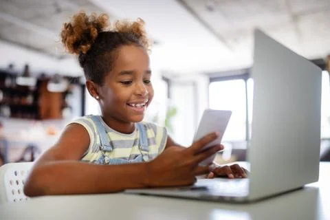 Game, study, fun concept. Happy children spending time with notebook and modern Stock Photos