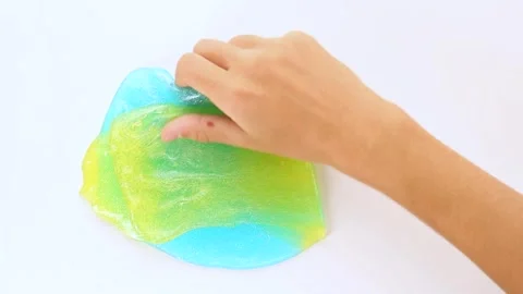 A game with textured multicolored slime stretching mixing turning into one color Stock Footage 250471456