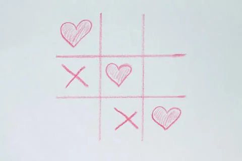 Game tic-tac-toe. Elements in the form of a red heart. 스톡 사진