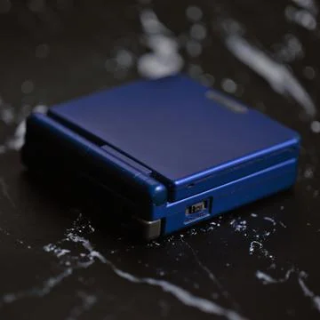 Gameboy Advance SP Closed Facing Away Stock Photos