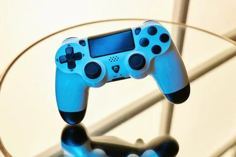Gamepad on abstract background with light effects Stock Photos