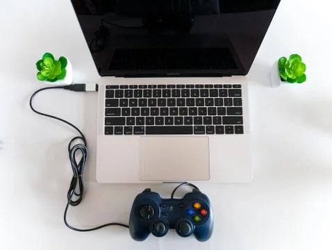 Gamepad Controller Attached to Laptop Stock Photos