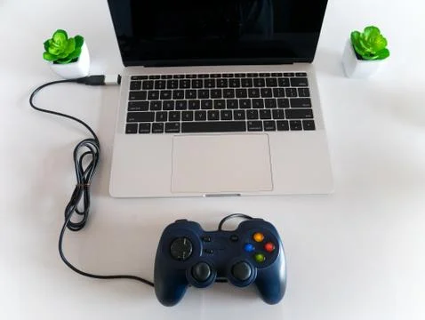 Gamepad Controller Attached to Laptop Stock Photos