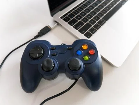 Gamepad Controller Attached to Laptop Stock Photos