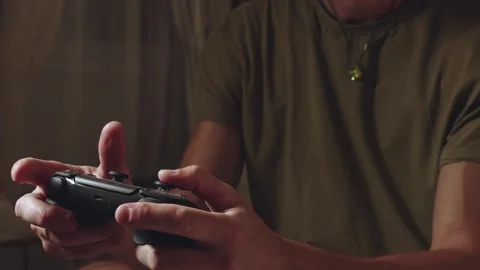 Gamepad in hand, game console, joystick while playing Stock Footage 315361399