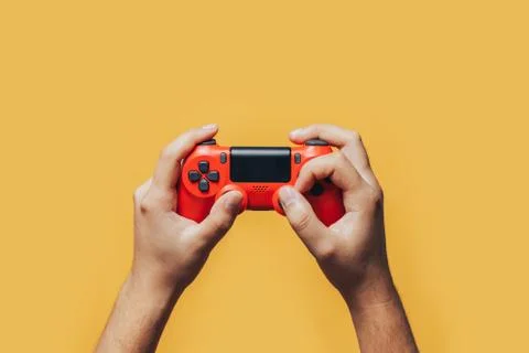 Gamepad in hands Stock Photos