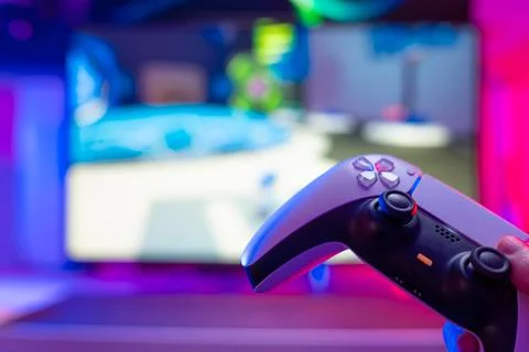 Gamepad on a technological background. Neon glow. Close-up. There are no peop Stock Photos