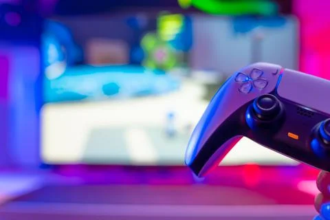 Gamepad on a technological background. Neon lighting. Close-up. Video games,  Stock Photos