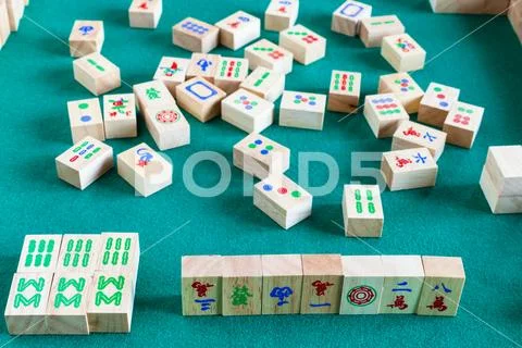 Gameplay of mahjong board game Stock Photos
