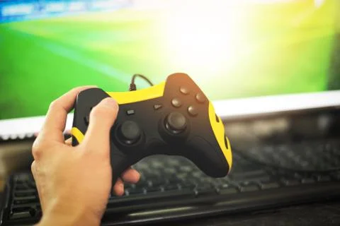Gamer and guy controller with game pad joystick on hand playing gaming and wa Stock Photos