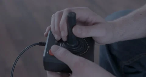 Gamer with an Atari 2600 controller Stock Footage 154482990
