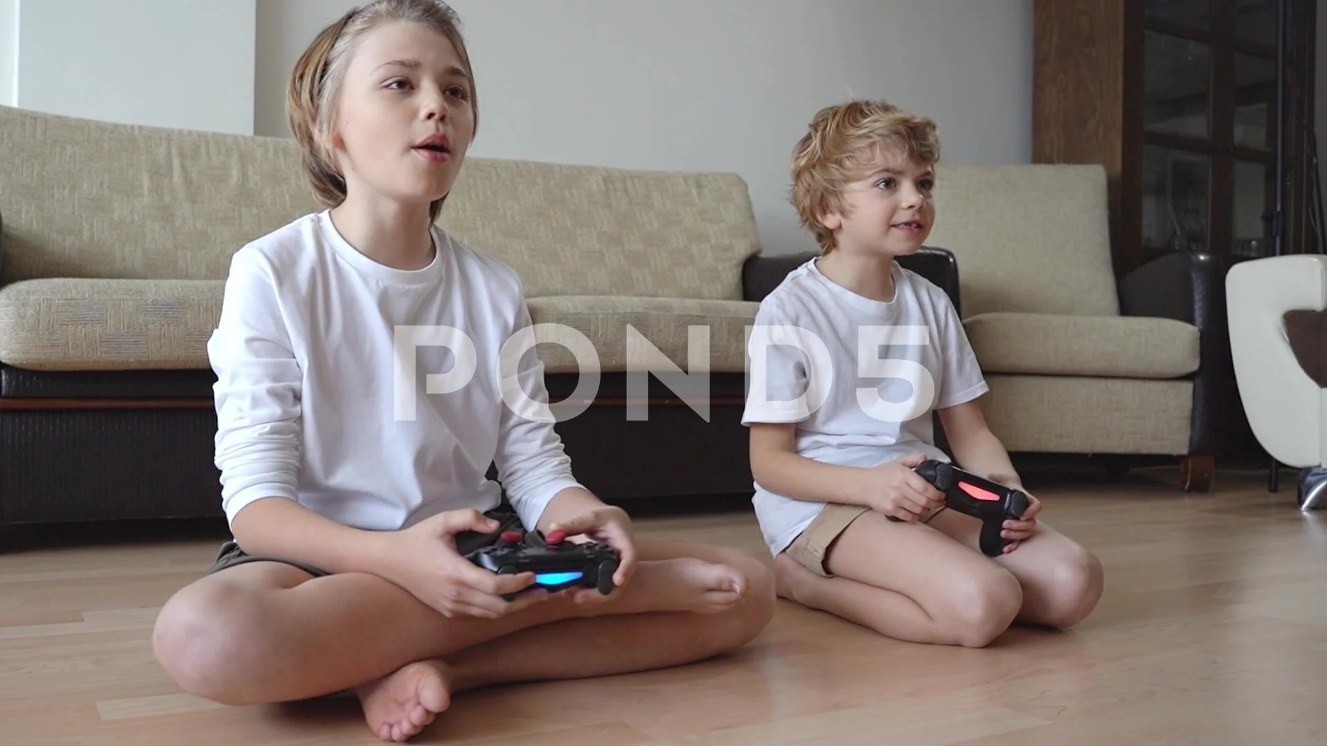 Gamer Children siblings playing video games in front of tv, using  playstati..