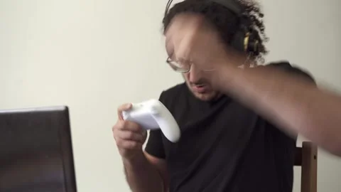 Gamer with computer laptop trash talks online opponents Stock Footage 290954086