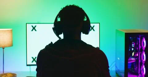 Gamer, computer screen or back of teen with headphones for esports competit.. Foto stock
