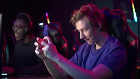 A gamer during a training session decided to relax and play a game on a Stock Footage 152799497