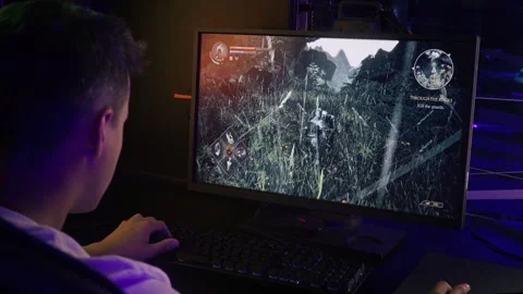 Gamer enjoying the level in a single player fake adventure action video game Stock Footage 268225976