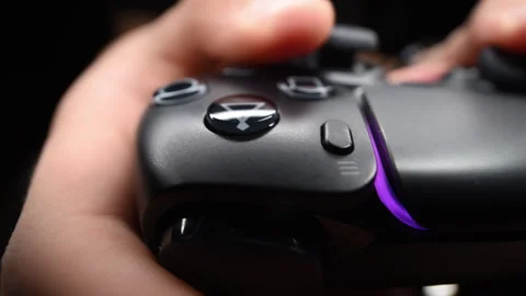 Gamer hand on video controller, highlighting fun and technology Stock Footage 319142264