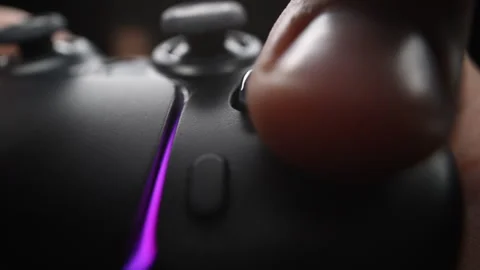 Gamer hand on video controller, highlighting fun and technology 動画素材 319142634