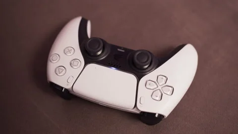 Gamer hands, man taking white gamepad, modern next gen console, online shopping Stock Footage 144579079