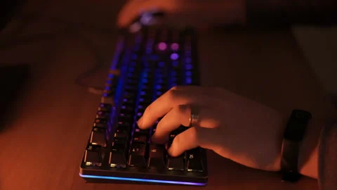 Gamer hands typing on computer keyboard with RGB backlit illumination, pro video Stock-Footage 141835890