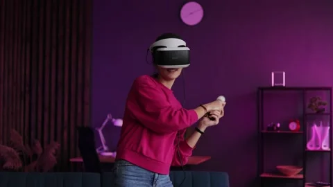Gamer having fun with new technology console with virtual reality experience Stock Footage 166364526