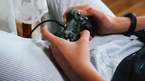 Gamer holding Gamepad, Controller or Videogame Joystick Console in hands. Stock Footage 131503256