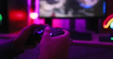 Gamer playing at computer game using joypad 動画素材 145432230