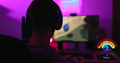 Gamer playing at computer game using joypad Video stock 145432254