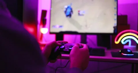 Gamer playing at computer game using joypad Video stock 145432260