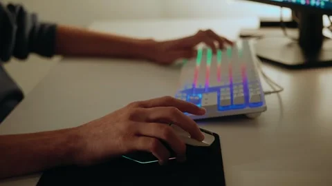 Gamer Playing on a Computer with RGB Keyboard and Mouse Stock Footage 336317064