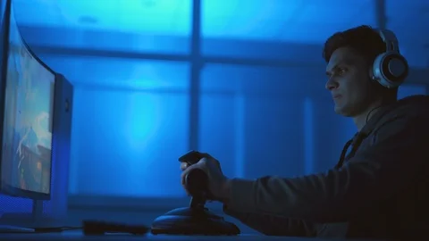 The gamer playing with flight stick controller in the dark room Video stock 127259920