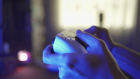 Gamer playing game console with game controller Stock Footage 247051009