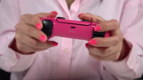 Gamer playing a game with a gamepad controller PlayStation 5 Video stock 233885020