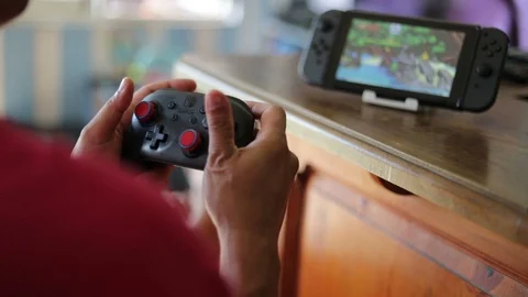 Gamer playing  on Nintendo Switch. Stock-Footage 109324491