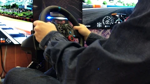 Gamer playing racing game on simulator w... | Stock Video | Pond5