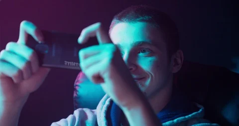 Gamer is playing on a smartphone Video stock 104206294