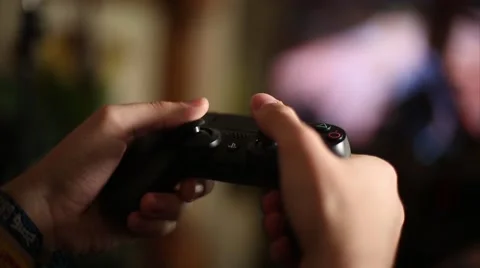 Gamer Playing Video Games with Controller Stock Footage