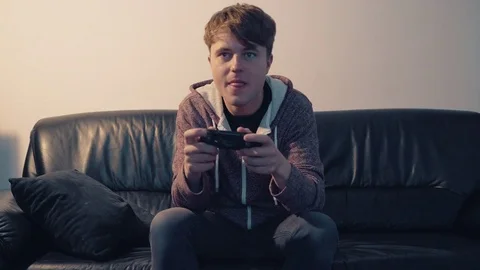 The gamer plays the game console Stock Footage 80082480